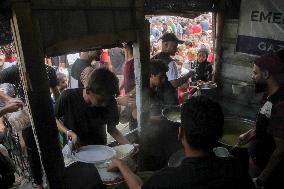 People Get Food Relief In Jabalia Refugee Camp - Gaza