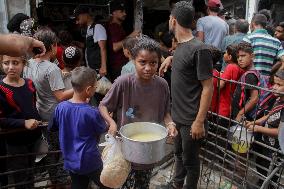 People Get Food Relief In Jabalia Refugee Camp - Gaza