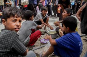 People Get Food Relief In Jabalia Refugee Camp - Gaza