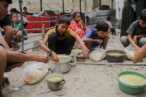 People Get Food Relief In Jabalia Refugee Camp - Gaza