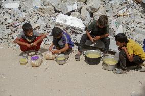 People Get Food Relief In Jabalia Refugee Camp - Gaza