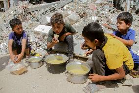 People Get Food Relief In Jabalia Refugee Camp - Gaza