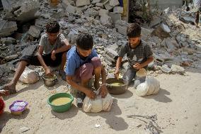 People Get Food Relief In Jabalia Refugee Camp - Gaza