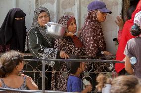 People Get Food Relief In Jabalia Refugee Camp - Gaza