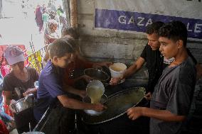 People Get Food Relief In Jabalia Refugee Camp - Gaza