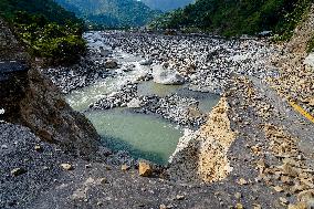 Kulekhani River Flood Damages Dakshinkali-Sisneri Road In Makwanpur, Nepal.