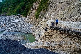 Kulekhani River Flood Damages Dakshinkali-Sisneri Road In Makwanpur, Nepal.