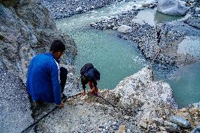 Kulekhani River Flood Damages Dakshinkali-Sisneri Road In Makwanpur, Nepal.