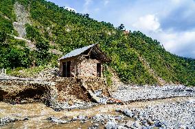 Kulekhani River Flood Damages Dakshinkali-Sisneri Road In Makwanpur, Nepal.