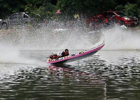 Rider Compete During The Annual ''Sword-Headed Boat Racing Festival