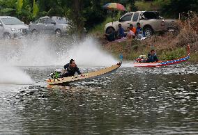 Rider Compete During The Annual ''Sword-Headed Boat Racing Festival