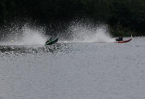 Rider Compete During The Annual ''Sword-Headed Boat Racing Festival