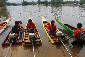 Rider Compete During The Annual ''Sword-Headed Boat Racing Festival