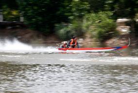 Rider Compete During The Annual ''Sword-Headed Boat Racing Festival