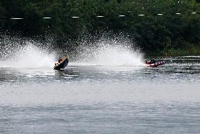 Rider Compete During The Annual ''Sword-Headed Boat Racing Festival