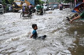 Waterlogged Streets Caused Heavy Rainfall In Dhaka, Bangladesh