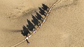 Tourists Riding Camels - China