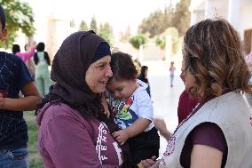 Lebanese take refuge at a monastery in Syria