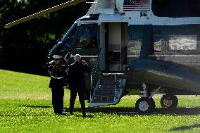 President Joe Biden departs the White House