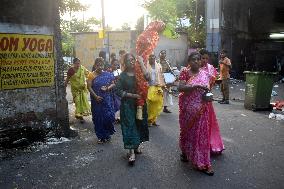 Devotees Performing Nabapatrika Ritual On The Occasion Of The Durga Puja Festival In Kolkata, India