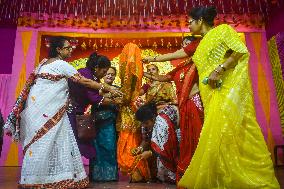 Devotees Performing Nabapatrika Ritual On The Occasion Of The Durga Puja Festival In Kolkata, India