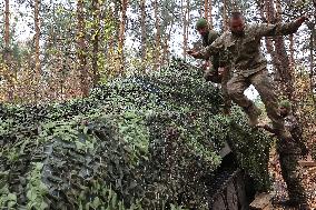 Ukrainian artillery crew at positions in Kharkiv region