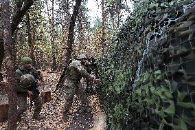 Ukrainian artillery crew at positions in Kharkiv region