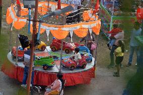 Children Enjoys Ride At Fair