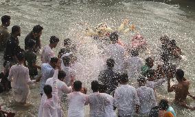 Hindu Devotees Carry An Idol Of Hindu Goddess Durga