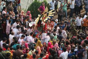 Hindu Devotees Carry An Idol Of Hindu Goddess Durga