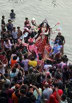 Hindu Devotees Carry An Idol Of Hindu Goddess Durga