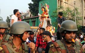 Hindu Devotees Carry An Idol Of Hindu Goddess Durga