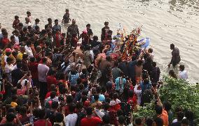 Hindu Devotees Carry An Idol Of Hindu Goddess Durga