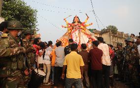 Hindu Devotees Carry An Idol Of Hindu Goddess Durga