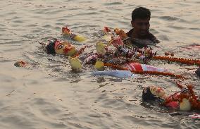 Hindu Devotees Carry An Idol Of Hindu Goddess Durga