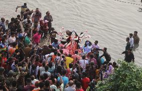 Hindu Devotees Carry An Idol Of Hindu Goddess Durga