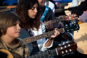 Guitar Players Are Simultaneously Played A Song In Sofia.