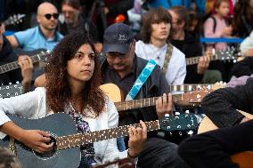 Guitar Players Are Simultaneously Played A Song In Sofia.