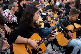 Guitar Players Are Simultaneously Played A Song In Sofia.