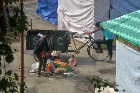 Workers Clean A Ground