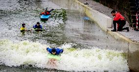 People Surfing In The Center Of Rotterdam