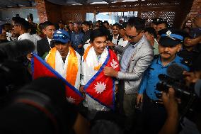 Record Holding Climbers “Nima Rinji Sherpa” And “Dawa Yangzum Sherpa” Return To Heroic Welcome In Nepal