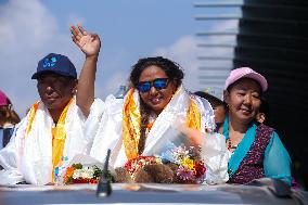 Record Holding Climbers “Nima Rinji Sherpa” And “Dawa Yangzum Sherpa” Return To Heroic Welcome In Nepal