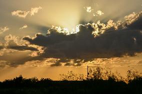 Sunset Between Clouds And Trees, In Florida