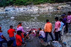 Devotees Immersing Durga Idol In Bagmati River, Nepal.