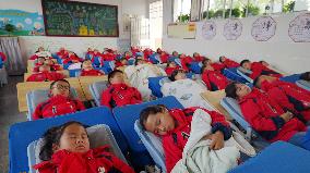 Students Nap in Enshi