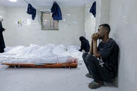 Relatives of the victims killed in the airstrike on Al-Mufti school in Nuseirat Camp