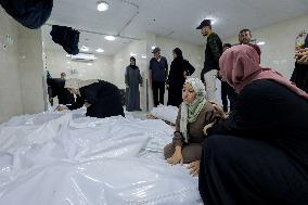 Relatives of the victims killed in the airstrike on Al-Mufti school in Nuseirat Camp