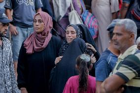 Relatives of the victims killed in the airstrike on Al-Mufti school in Nuseirat Camp