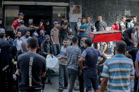 Relatives of the victims killed in the airstrike on Al-Mufti school in Nuseirat Camp